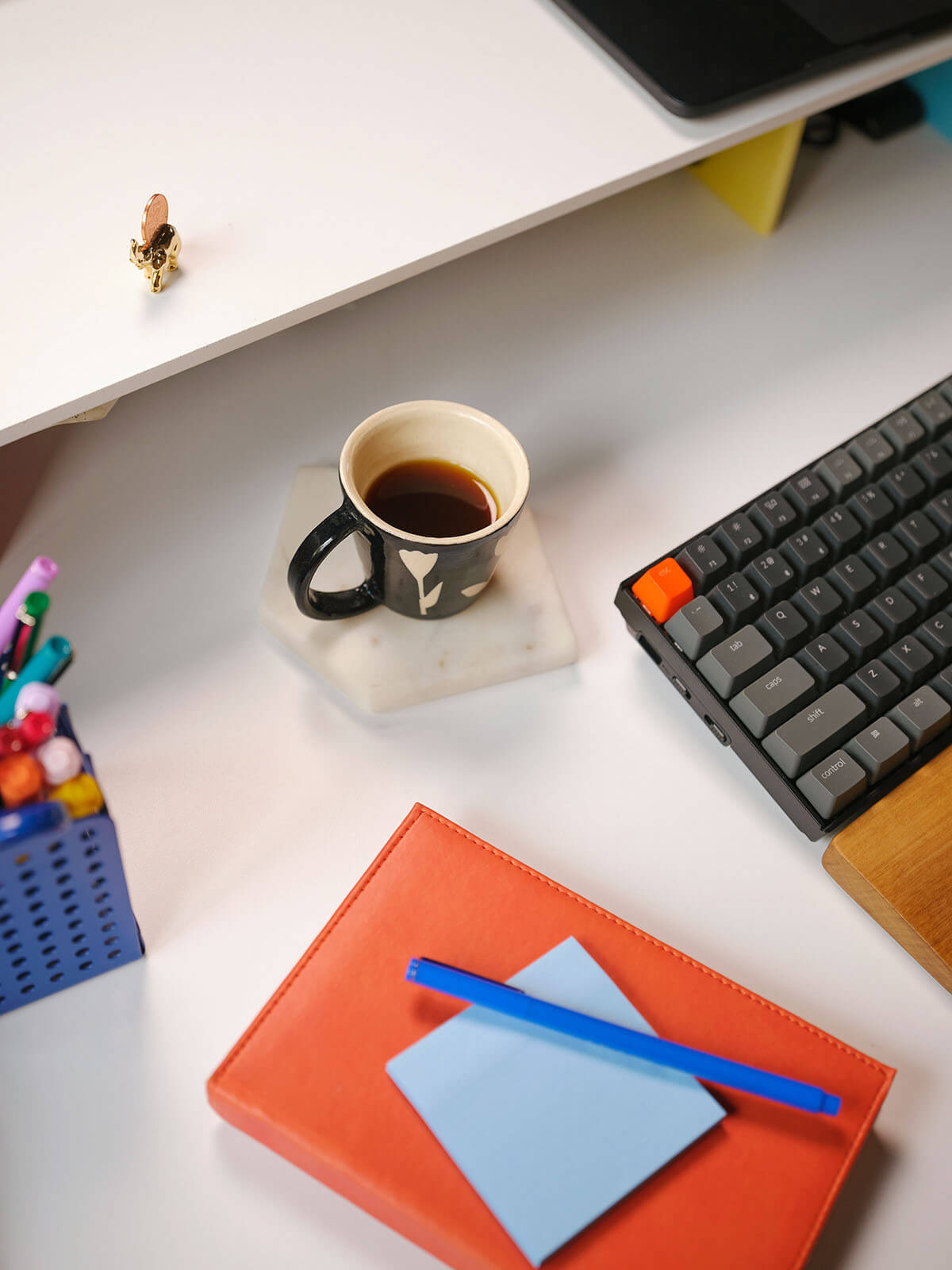 A cup of coffee on a desk, symbolizing the dynamic and energizing atmosphere of a software company